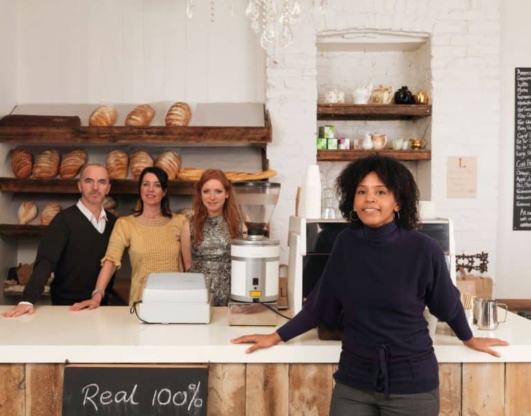 business owner posing with employees 2024 11 03 05 00 54 utc