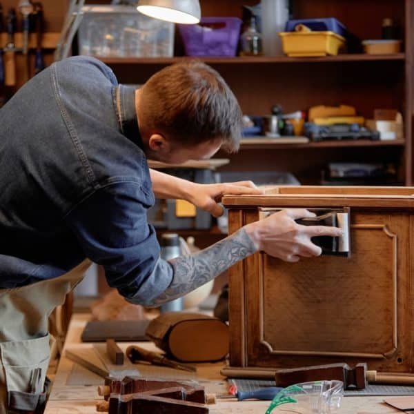 Crafting Antique Furniture in Woodworking Workshop
