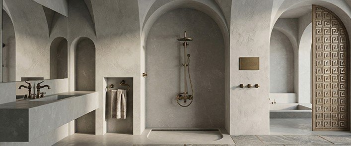 Salle de bains minimaliste dotée d'alcôves voûtées, d'un double lavabo, d'une douche, d'un porte-serviettes, de robinetterie en laiton et d'une porte décorative à motifs. L'espace se caractérise par des couleurs neutres et des surfaces lisses.