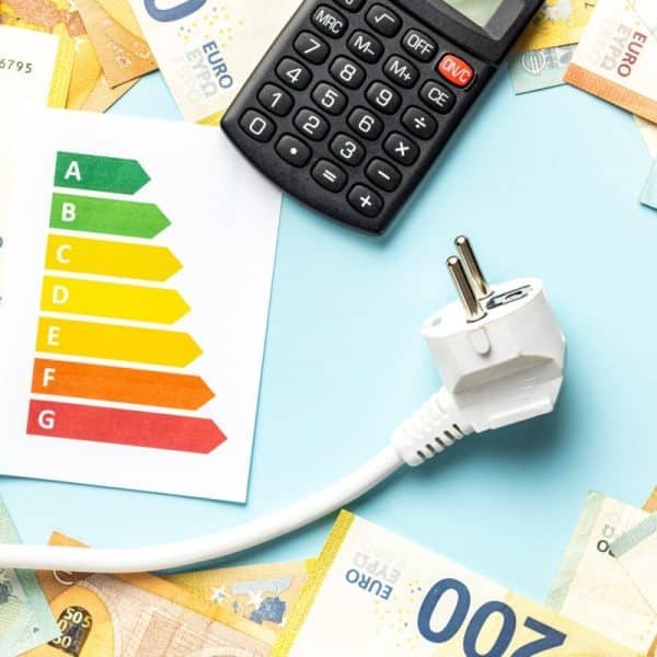Electric plug, calculator, energy label and euro money on blue background.