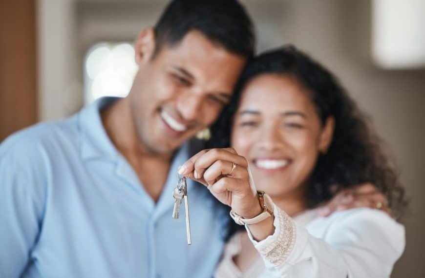 House keys, new home or happy couple hug in real estate, property investment or buying an apartment