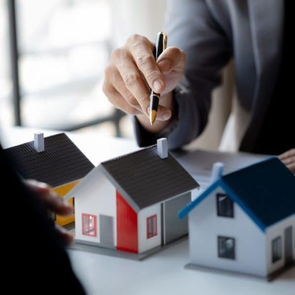 Real estate agents explain models of housing estates in projects.