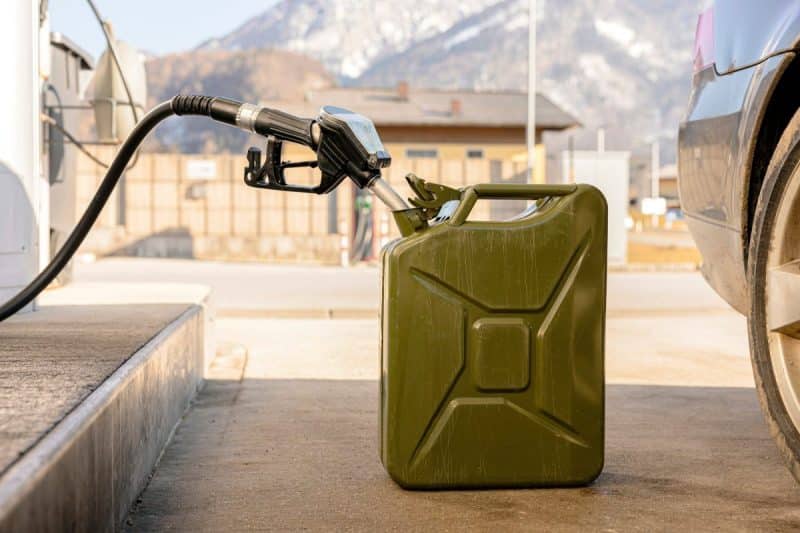 Refilling canister with fuel on the petrol station. Close up view. Fuel, gasoline, diesel