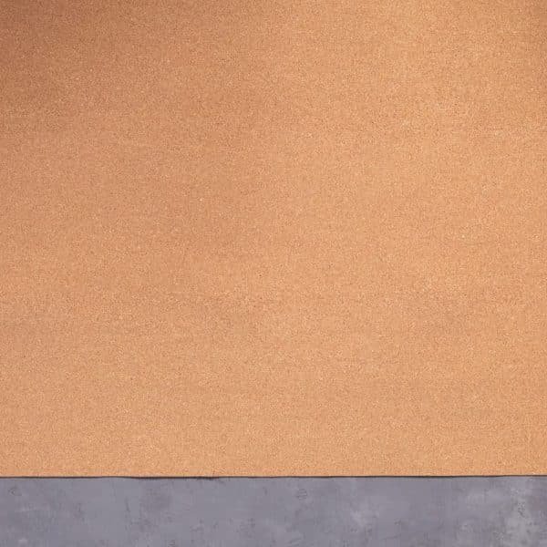 Roll of cork at cement floor background texture. Corkboard at wall