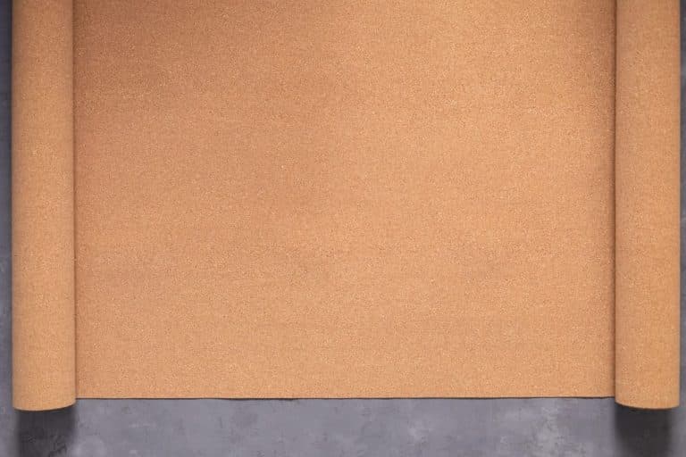 Roll of cork at cement floor background texture. Corkboard at wall