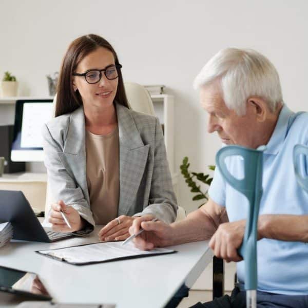 Senior man signing insurance contract
