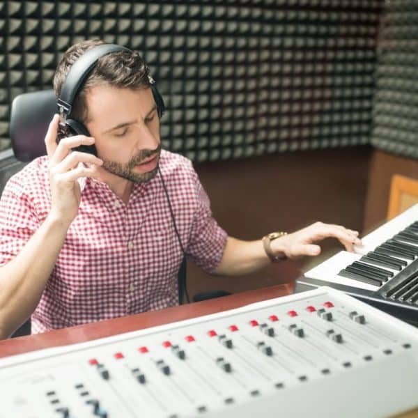 Sound engineer working in soundproof recording studio